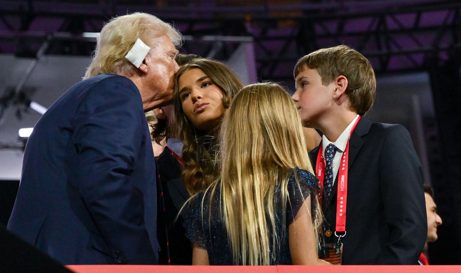 Trump kisses his granddaughter Kai at the convention. <a href="index.php?page=&url=https%3A%2F%2Fwww.cnn.com%2Fpolitics%2Flive-news%2Frnc-republican-national-convention-07-17-24%23h_5f6342806745e44848f5445a889f71ca">She addressed the crowd on Wednesday</a> and described the former president as a proud grandfather and an inspiration to her.