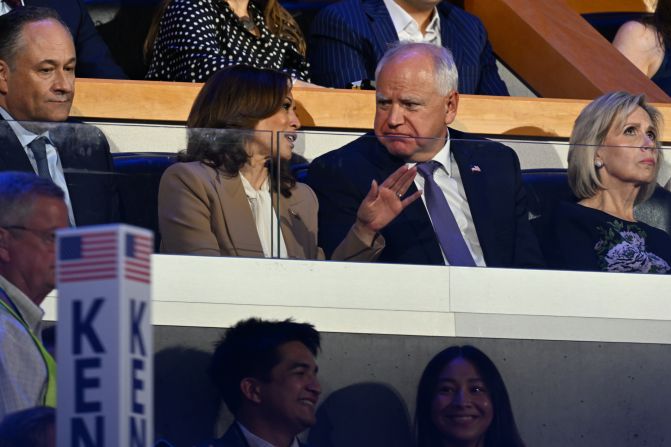 Harris talks with Walz from a VIP suite at the United Center.