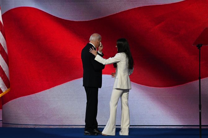 Biden appears to wipe away tears as he is greeted by his daughter, Ashley, who introduced him to the crowd Monday.