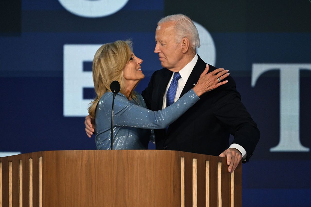 First lady Jill biden embraces her husband President Joe Biden following his remarks at the DNC on Monday, August 19.