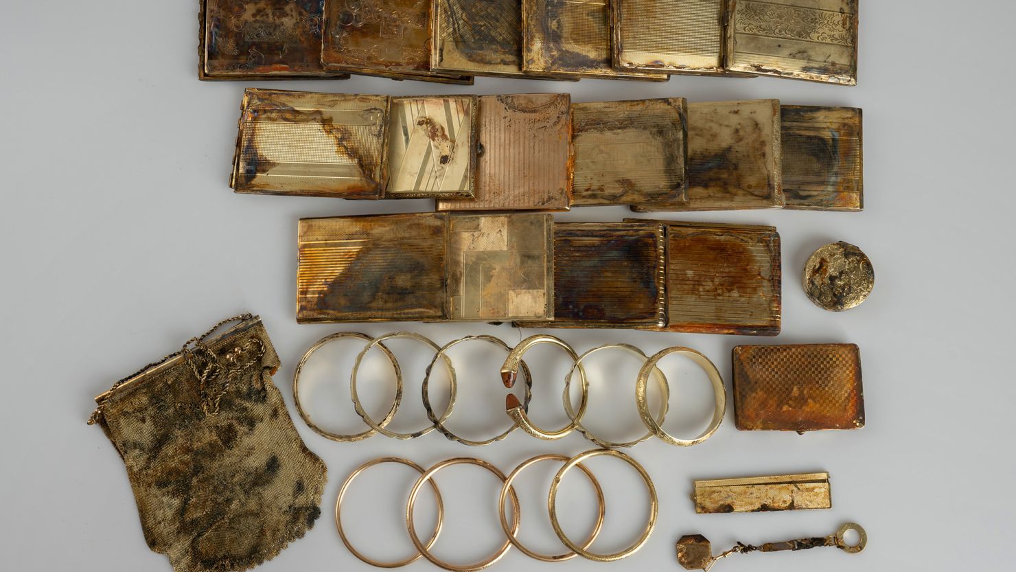 Hikers came across a stash of 598 gold coins and other items worth at least $360,000 in the northern Czech Republic, but its origin is unclear.