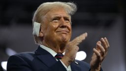 Former President Donald Trump applauds during the Republican National Convention in Milwaukee on July 17.