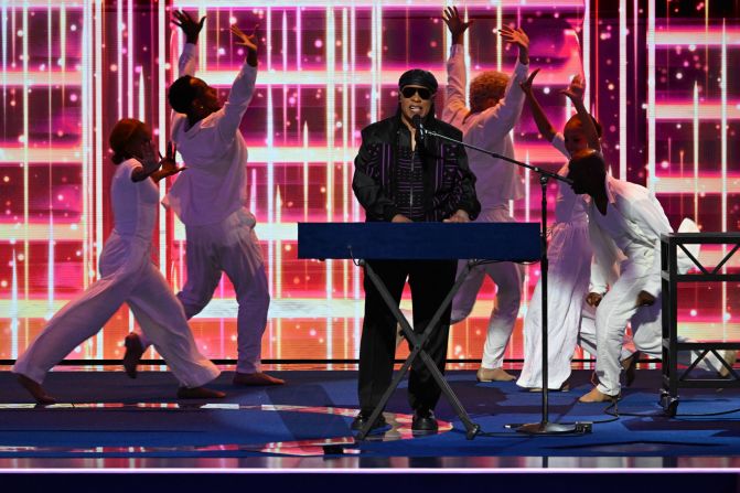 Legendary musician Stevie Wonder <a >performs his hit song "Higher Ground"</a> at the convention on Wednesday. "As we stand between history’s pain and tomorrow’s promises, we must choose courage over complacency," he said before his performance. "It is time to get up and go vote.”