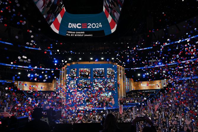 Balloons fall from the ceiling of Chicago's United Center at the end of the convention on Thursday.