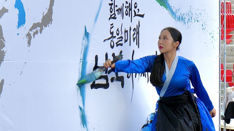 A performer does live calligraphy at the Defectors' Day celebration in Seoul, South Korea, on July 14.