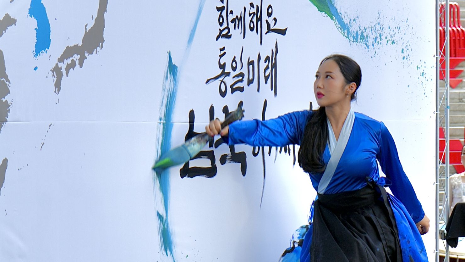 A performer does live calligraphy at the Defectors' Day celebration in Seoul, South Korea, on July 14.