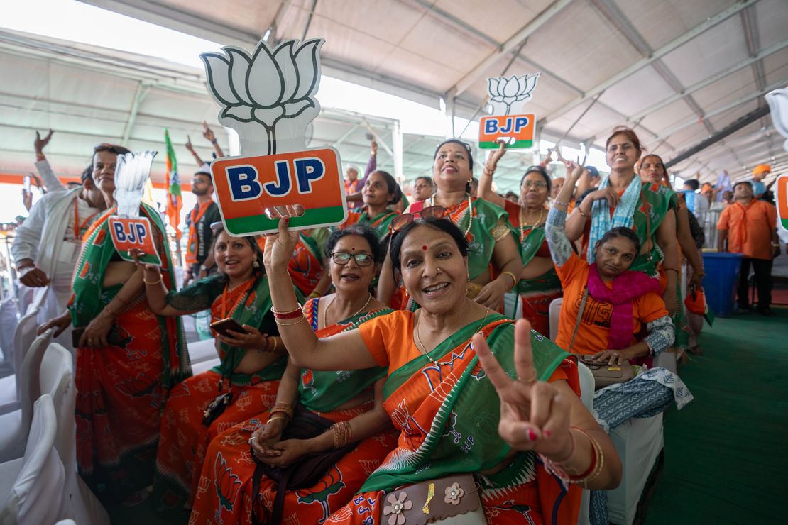 Modi supporters dress in saffron saris, the color of his Bharatiya Janata Party, in Aligarh, India, on April 22, 2024.