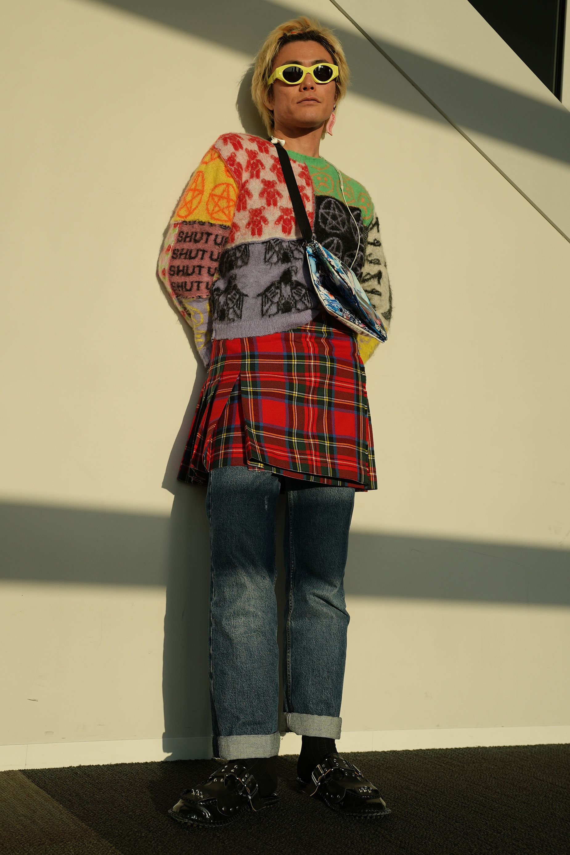 Yu Masui’s colorful outfit combined an Ashley Williams sweater with a Christopher Kane kilt over Dries Van Noten jeans. I change my style every day,” he said, describing his personal style as being like “chameleon.” He added: “Today my theme is punk with ‘90s Harajuku-ness.”