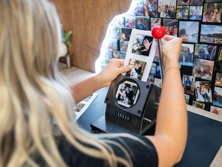 Howell makes a magnet in her home office on August 27. She also sells the machines for people who want to start their own magnet businesses.