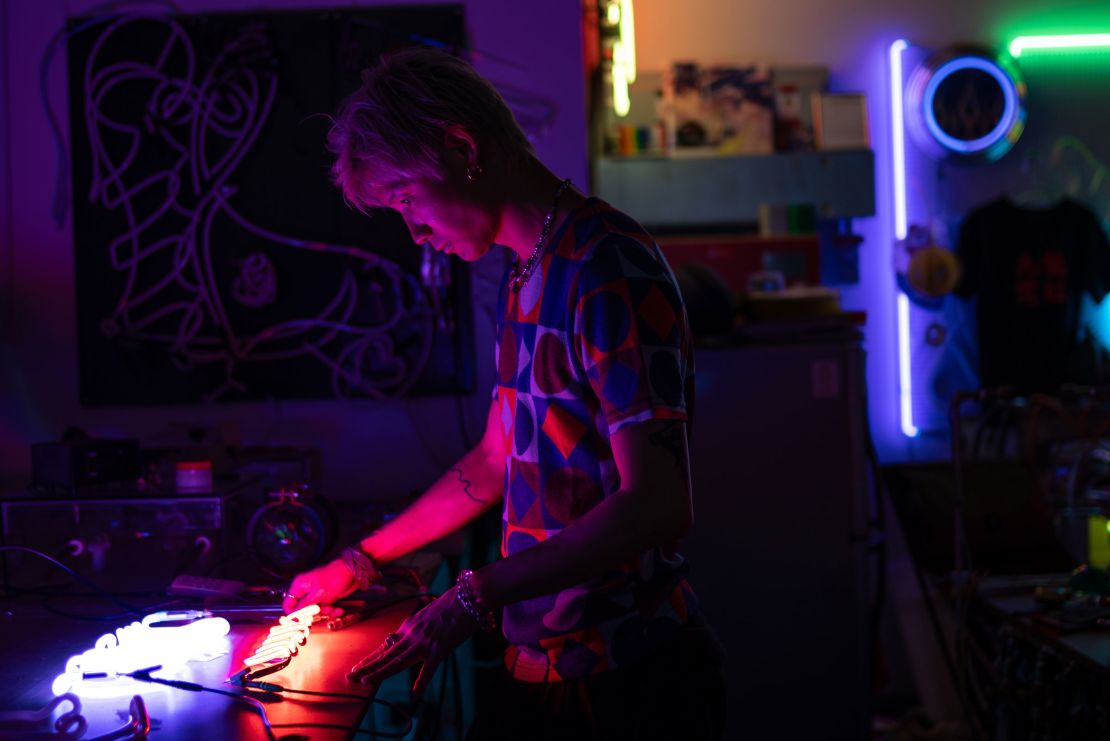 Jive Lau checks one of his work at his studio on May 16.