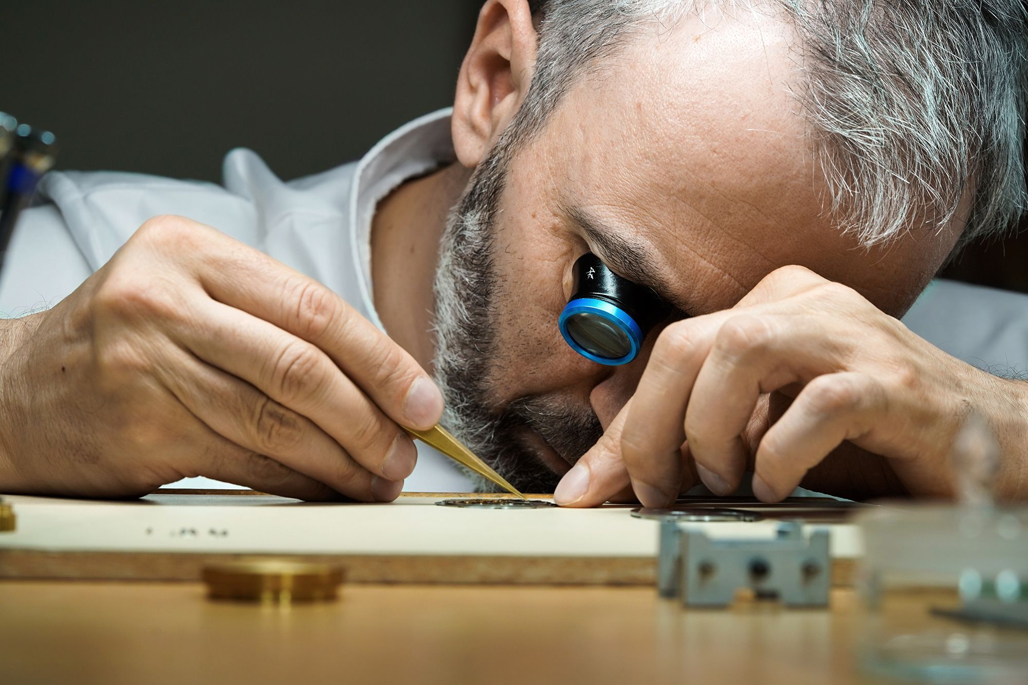 Watchmaker Konstantin Chaykin at work on his 1.65-millimeter-thick ThinKing prototype.