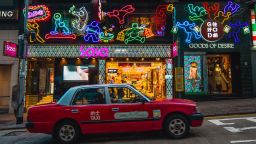 A neon sign titled "Enjoy Yourself Tonight," by artist Jive Lau is seen in the Central district of Hong Kong, China, on Saturday.