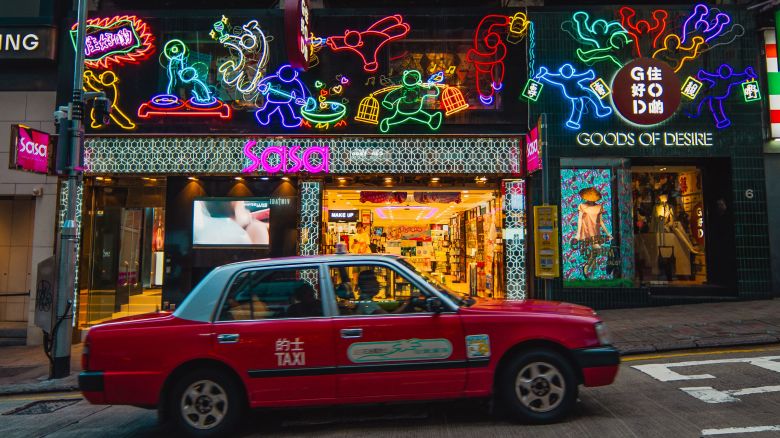 A neon sign titled "Enjoy Yourself Tonight," by artist Jive Lau is seen in the Central district of Hong Kong, China, on Saturday.
