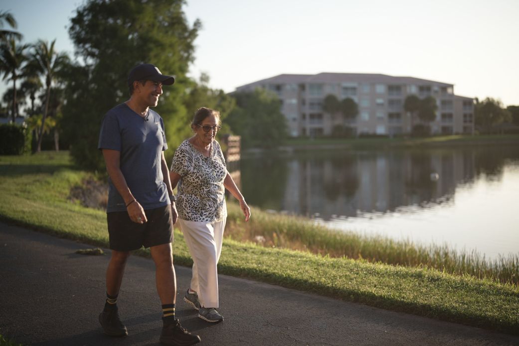 Dr. Sanjay Gupta walks with his mom. Rather than defaulting to rest, there's a growing consensus that movement and exercise can be a key part of recovery after an injury.