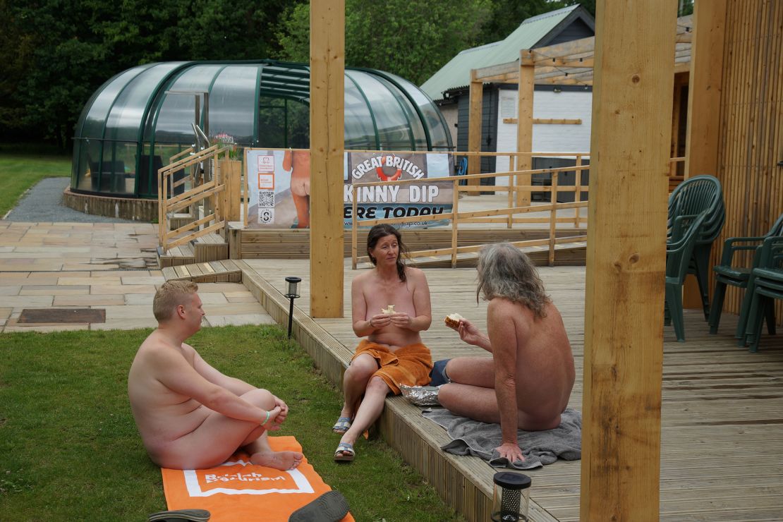 James Shuttleworth (left), International Youth Officer for the INF-FNI, relaxes with fellow guests at the opening ceremony for British Naturism: Sunfolk.
