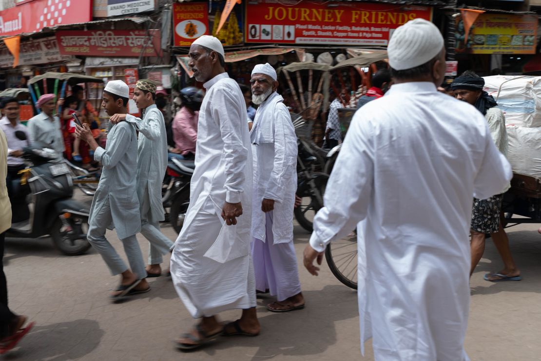 Muslims return after offering prayer at the Gyanvapi Mosque.