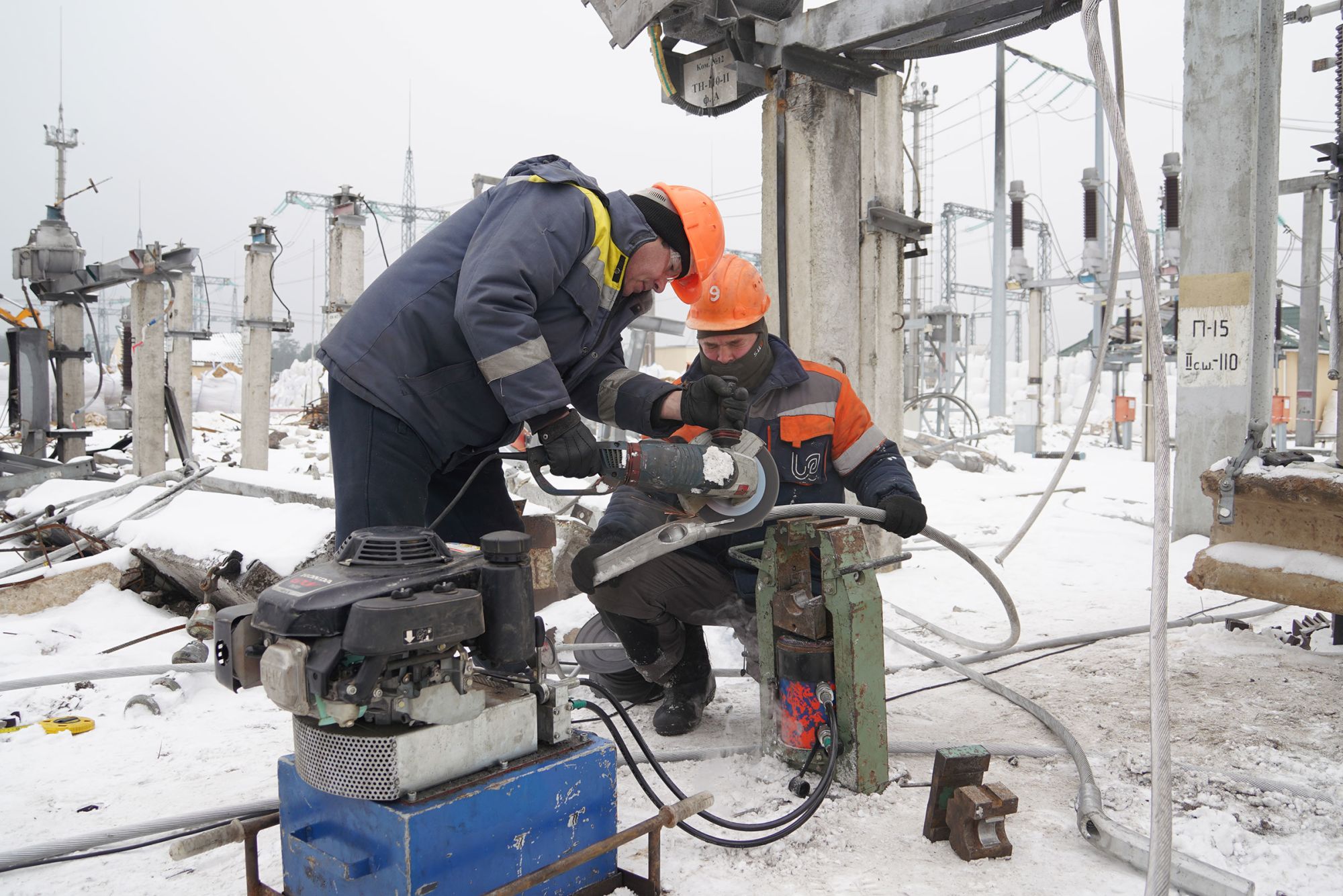 In this undated photo, an employee at Ukraine’s state-owned grid operator, Ukrenergo, works on the power grid.