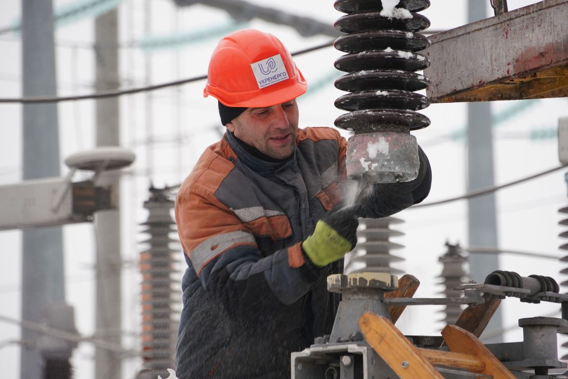 In this undated photo, an employee at Ukraine’s state-owned grid operator, Ukrenergo, works on the power grid.