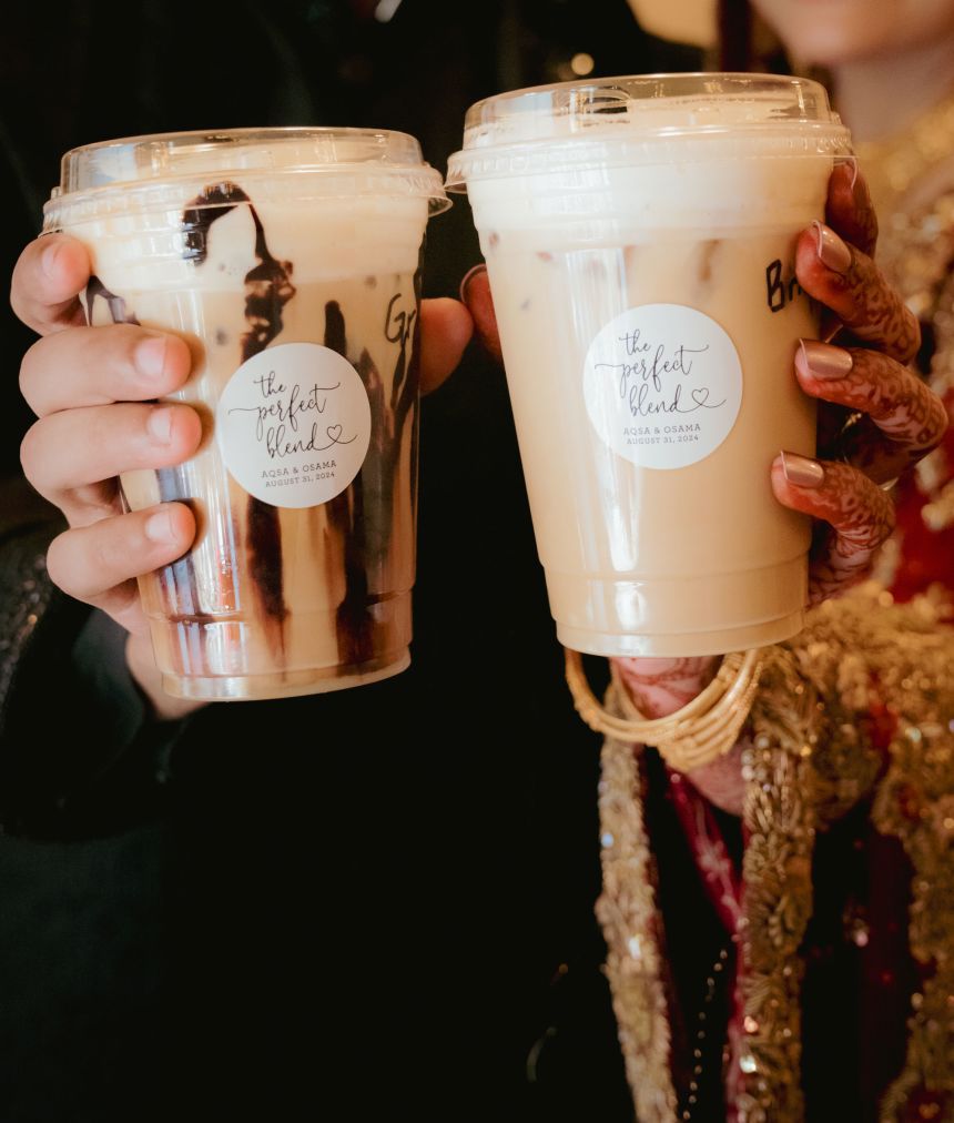 A bride and groom at a wedding show off beverages from the Qadeer siblings' coffee cart.