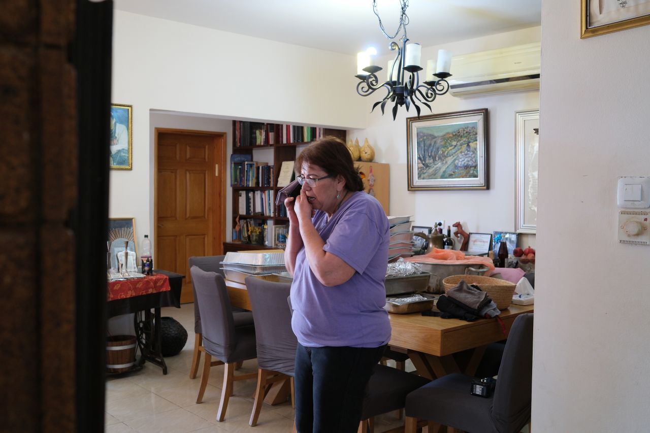 Ora Hatan speaks on the phone at her house near the Israeli border with Lebanon.