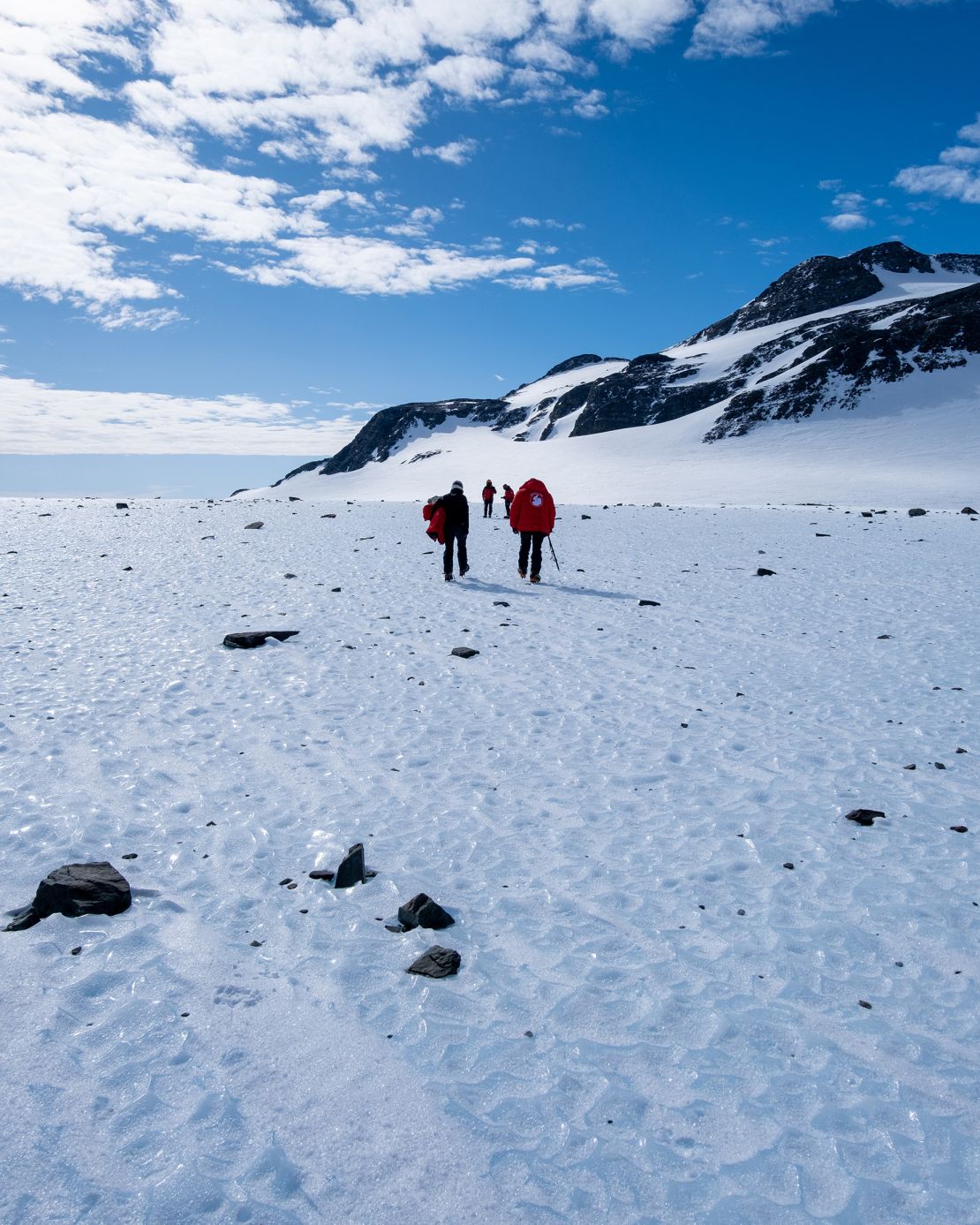 Meteorites are disappearing into the Antarctic ice, a new study says, as a result of the climate crisis. Ice sampling occurs on a blue ice area during the 2022 Chilean Antarctic Institute field mission.