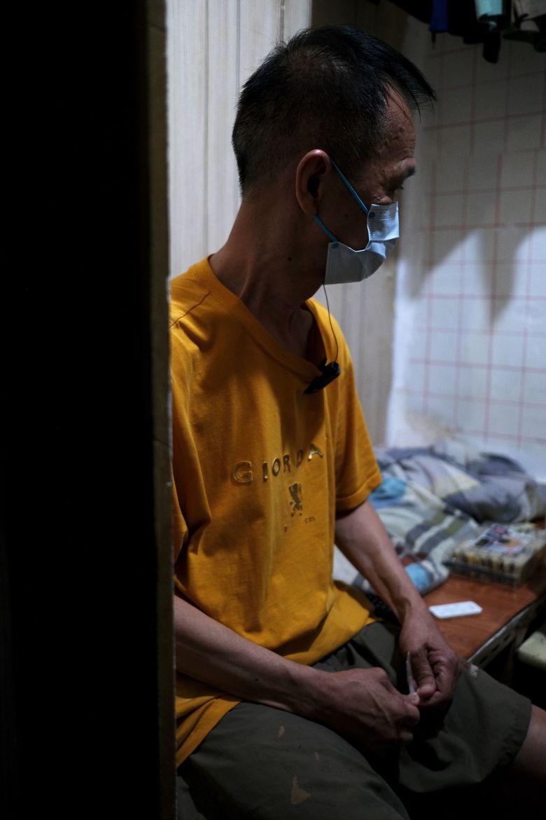 Mr. Tse in his home at a subdivided flat in Sham Shui Po, Hong Kong, on July 3, 2025.