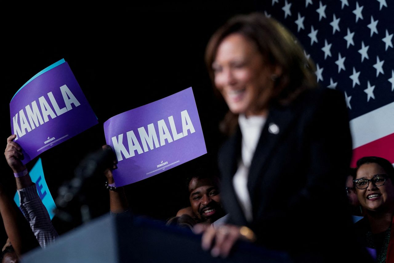 Supporters hold signs as Vice President Kamala Harris delivers remarks in Philadelphia, in February 2023. 