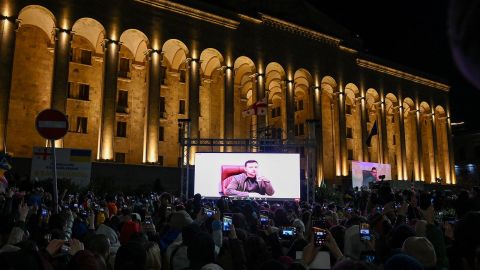 Demonstrators in Tbilisi, Georgia, watch an address by Ukrainian President Volodymyr Zelensky on March 4.