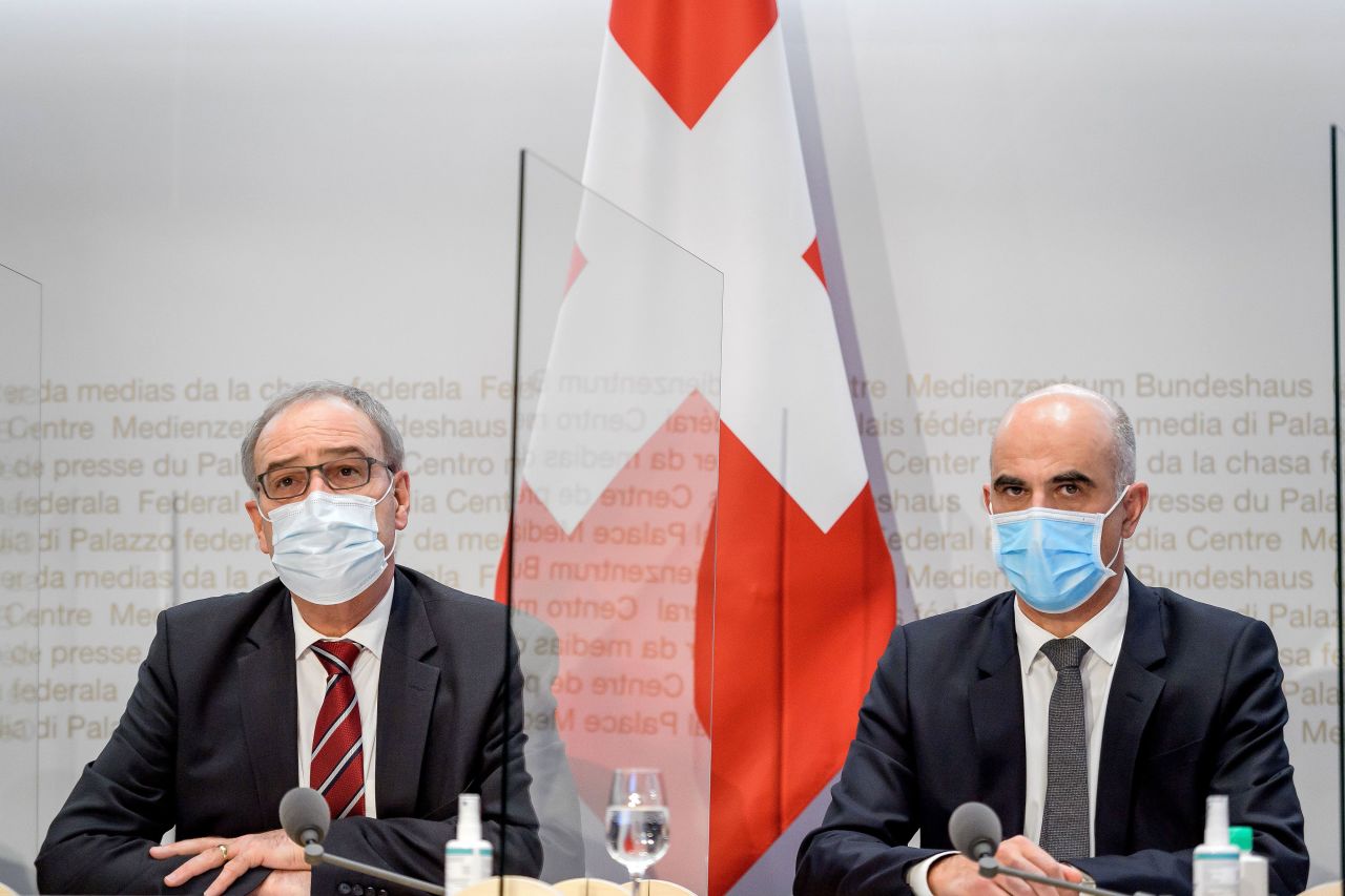 President of Switzerland Guy Parmelin, left, and Federal Councillor Alain Berset attend a press conference on January 13 in Bern, Switzerland.