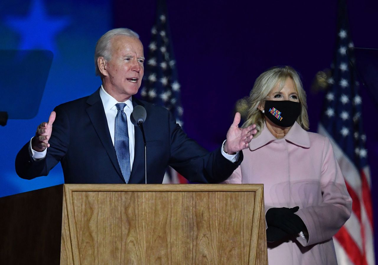 Democratic presidential nominee Joe Biden along with his wife Jill Biden speaks during election night at the Chase Center in Wilmington, Delaware, early on November 4.