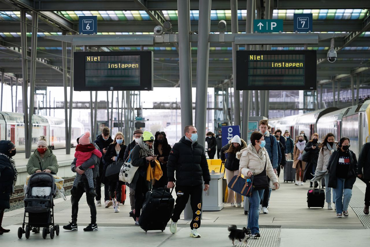 People get off the last train arriving at Oostende station in Belgium, on Friday, February 18. 