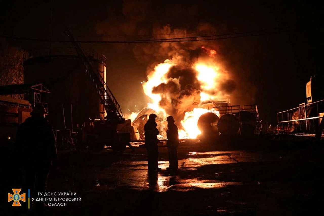 Firefighters work at a site of burning fuel storage facilities damaged by an airstrike in Dnipropetrovsk region, Ukraine, on April 6.