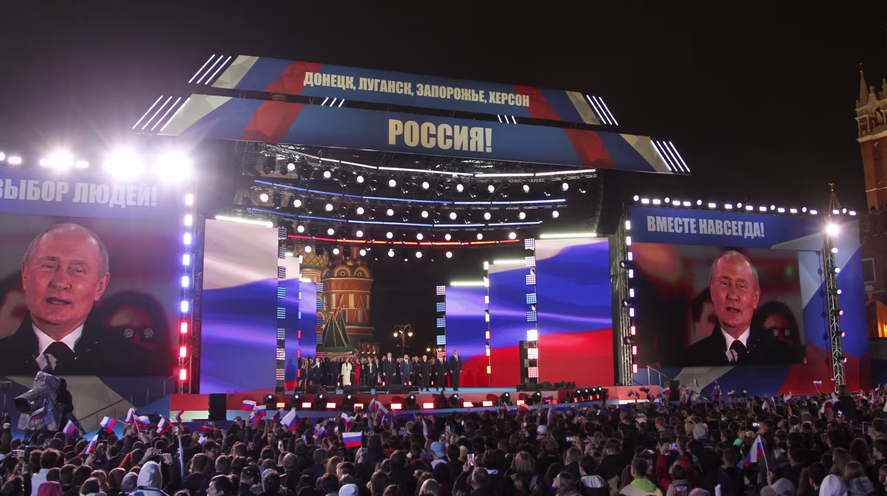 Russian President Vladimir Putin speaks during the concert in support of the annexation of four Ukrainian regions at Red Square, on September 30, 2022 in Moscow, Russia. Separatist leaders of annexed Donetsk, Luhansk, Kherson and Zaporizhzhia regions of Ukraine has arrived in Moscow to sign joint documents.