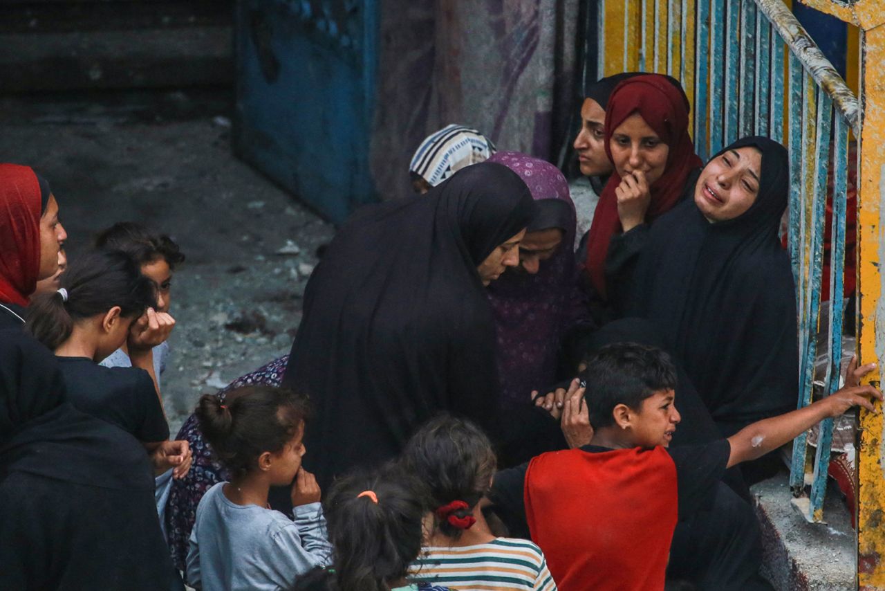 Palestinians react at a UN-school housing displacing people that was hit during Israeli bombardment in Nuseirat, in the central Gaza Strip, on June 6.