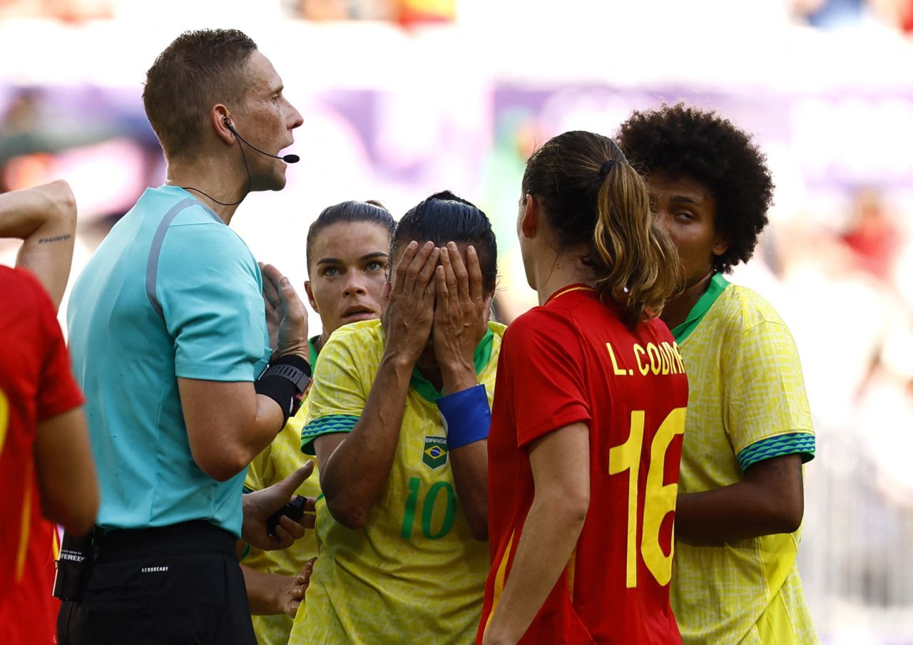 Marta of Brazil, center, reacts after being shown a red card by referee Espen Eskas on Wednesday.