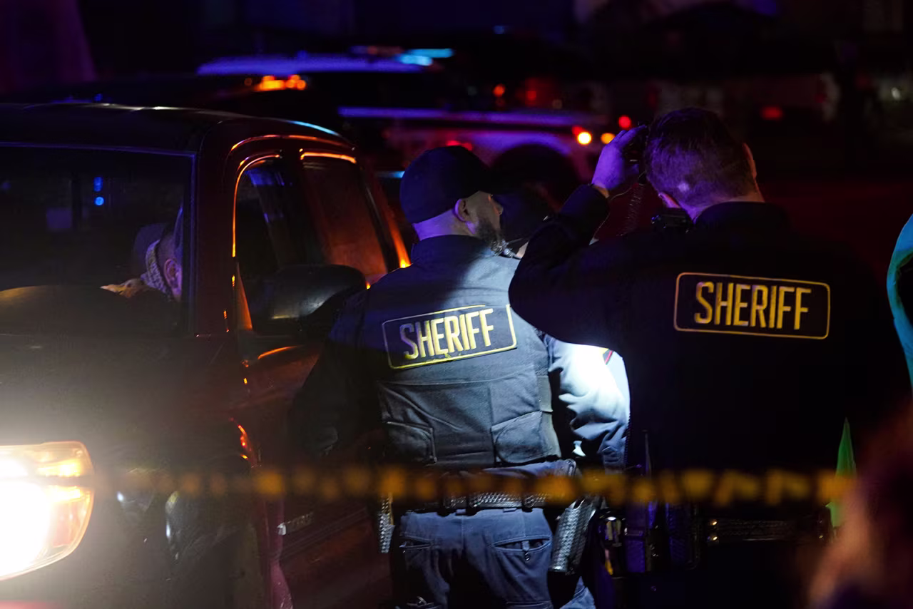 Law enforcement personnel control the scene of a shooting in Half Moon Bay, California on Monday, January 23.