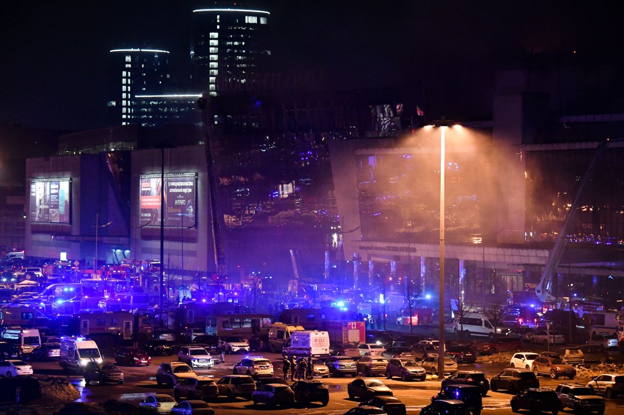 Emergency services personnel and servicemen are seen outside the Crocus City Hall concert hall in Krasnogorsk, outside Moscow, on Friday.