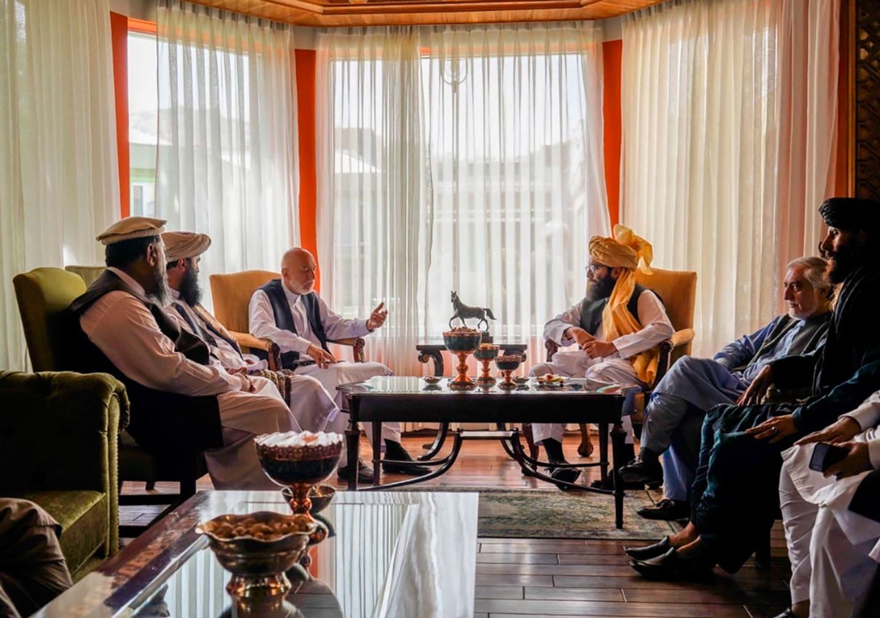 Karzai (center left) meets with senior Haqqani group leader Anas Haqqani (center right) and Abdullah Abdullah (second right) in Kabul on August 18. 