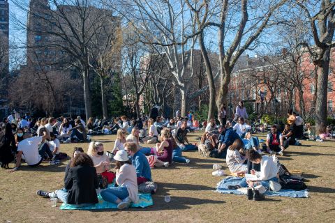 People gather in Washington Square Park on Sunday, March 21, in New York City. 