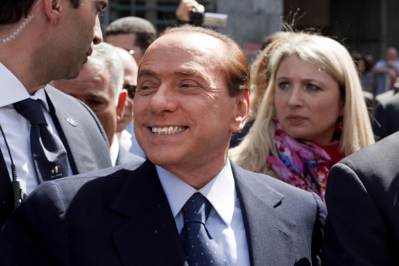 Silvio Berlusconi speaks outside a courthouse in Milan after a legal hearing to face tax fraud charges related to his media businesses, in April 2011. 