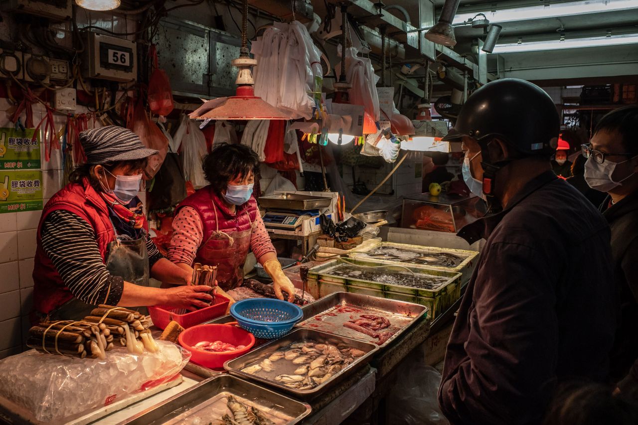 Residents purchase seafood at a wet market on January 28, in Macau, China. 