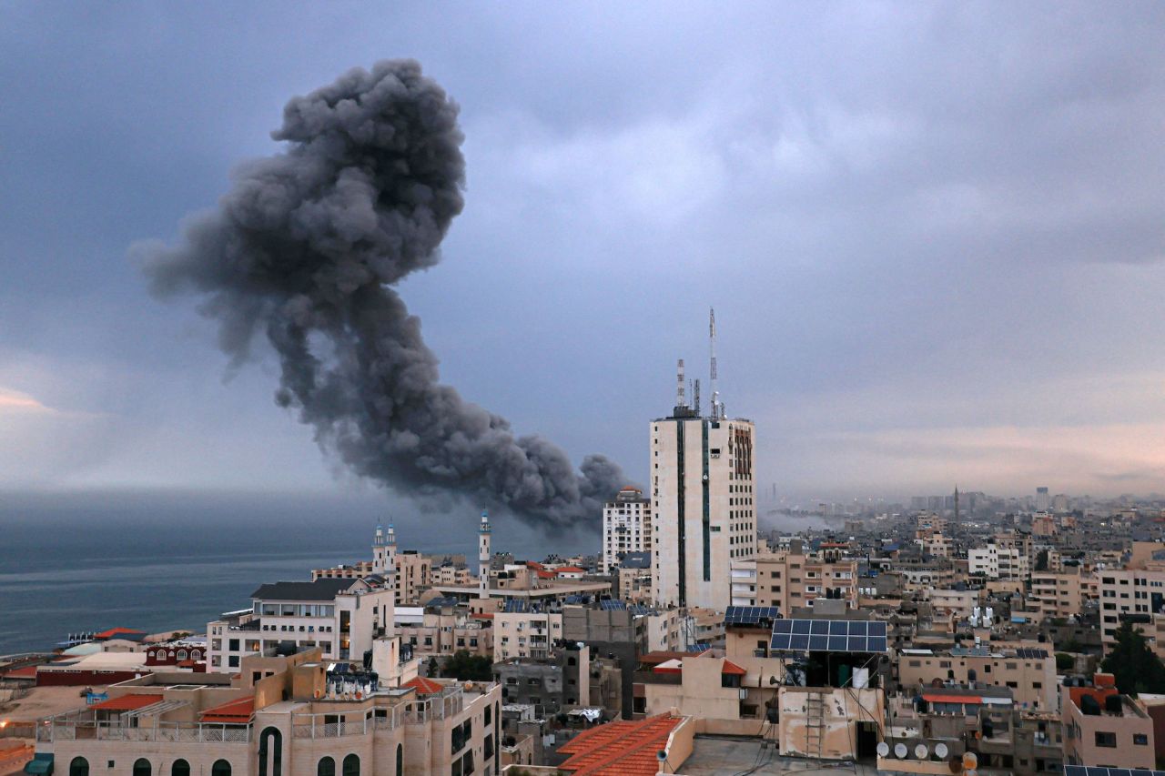 Smoke rises above buildings during an Israeli airstrike in Gaza City on Monday.