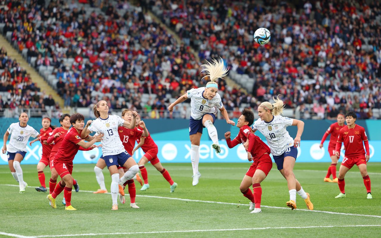 Julie Ertz of the United States jumps for the ball.