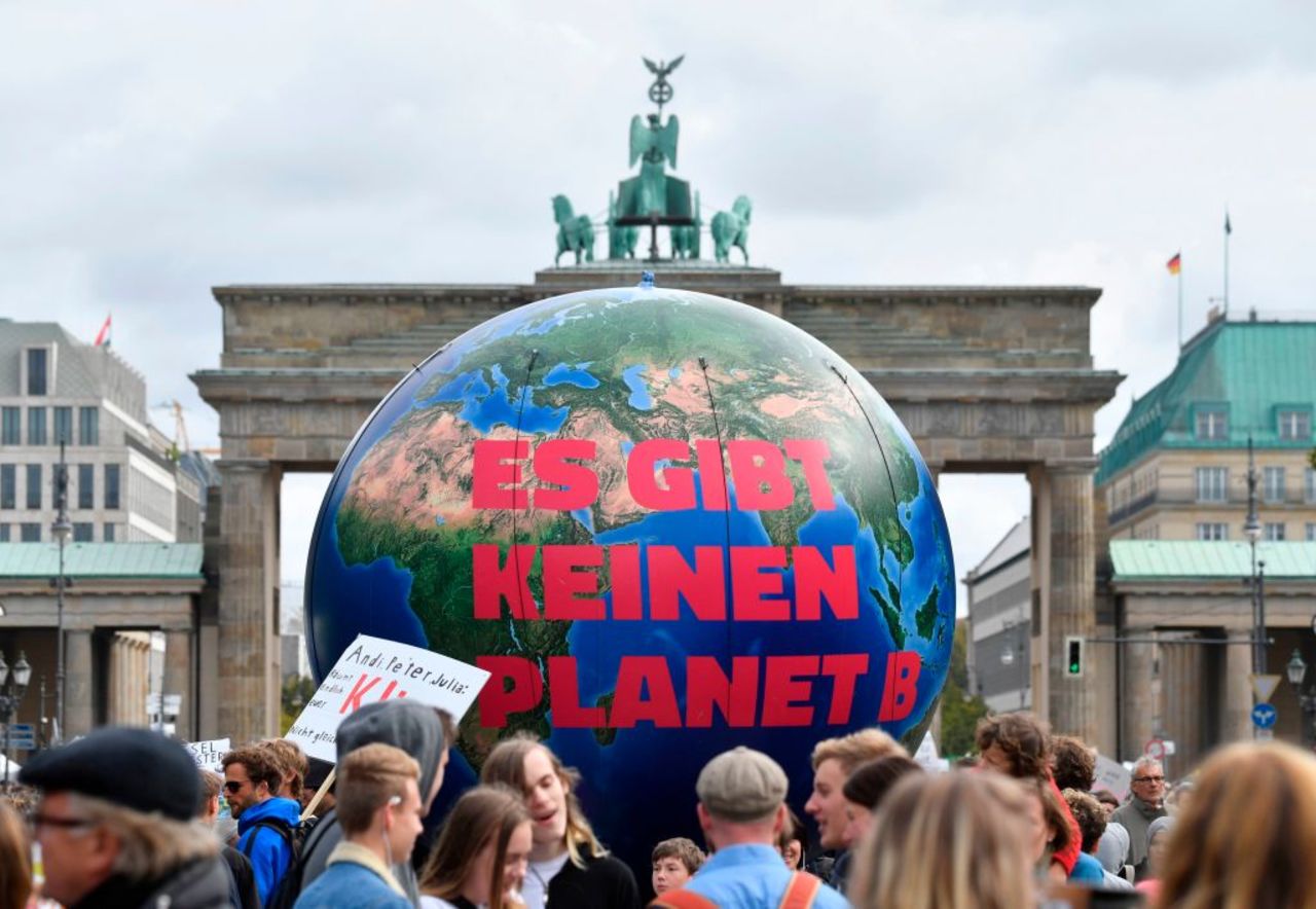 A balloon reads "There is no Planet B" at the Brandenburg Gate in Berlin.