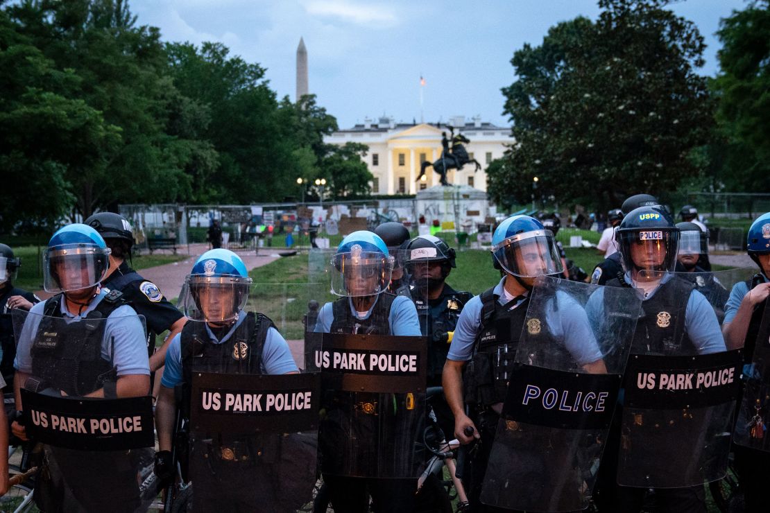 U.S. Park Police keep protesters back after they attempted to pull down the statue of Andrew Jackson in Lafayette Square near the White House on June 22 in Washington.