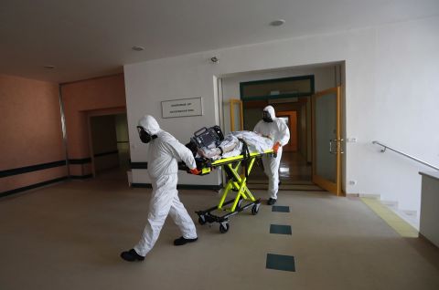 Healthcare workers transport a Covid-19 patient from an intensive care unit at a hospital in Kyjov to a hospital in Brno, Czech Republic on October 22.
