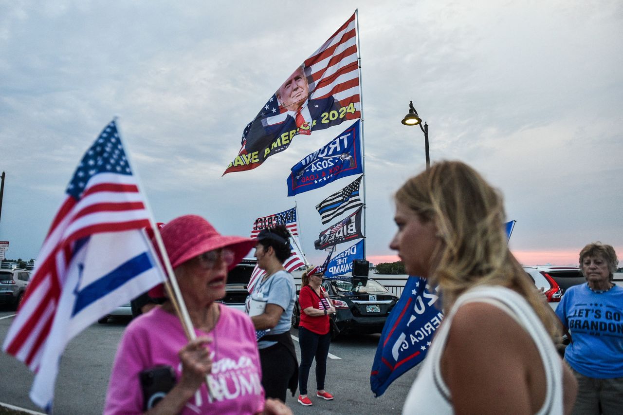 Supporters of former US President and Republican presidential candidate Donald Trump gather near his residence at Mar-a-Lago as they react after he was convicted in his criminal trial, in Palm Beach, Florida, on May 30. 