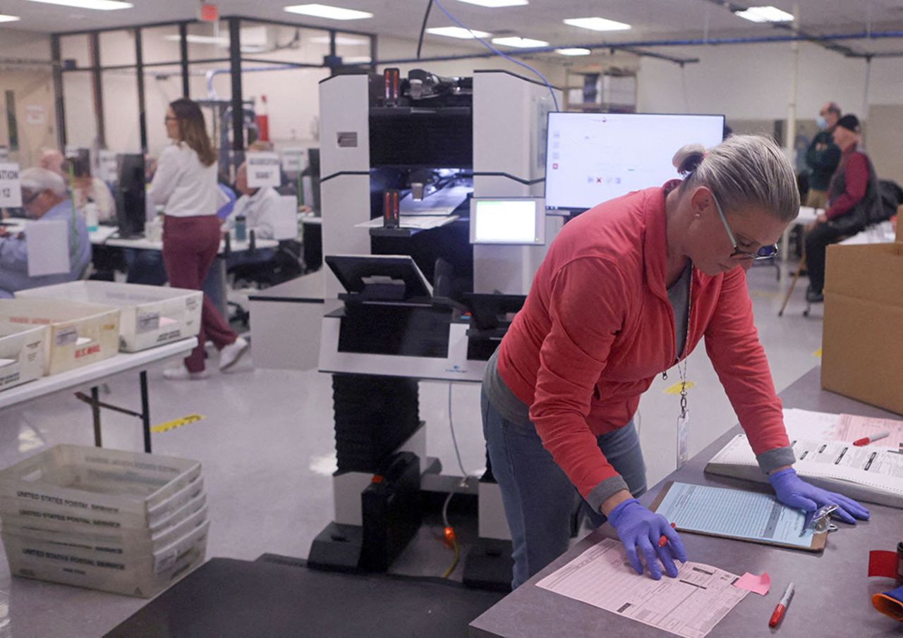 Ballots are counted with a machine at the Maricopa County Tabulation and Election Center in Phoenix, Arizona, on November 9. 