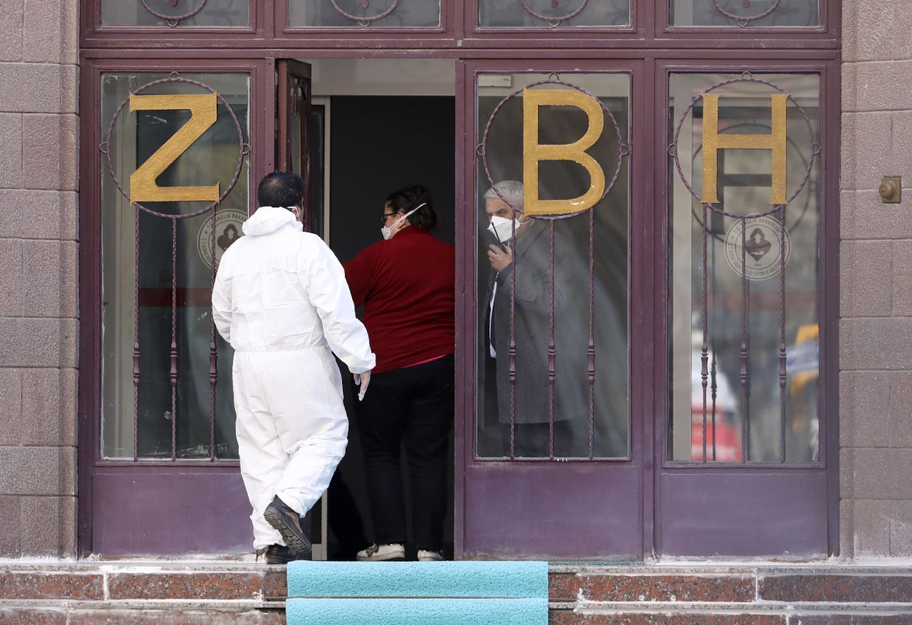 Medical staff enter the Zekai Tahir Burak Hospital where 17 passengers from a Turkish Airlines evacuation flight from Tehran, suspected of having coronavirus, are to be quarantined, in Ankara, Turkey, on Tuesday, February 25.