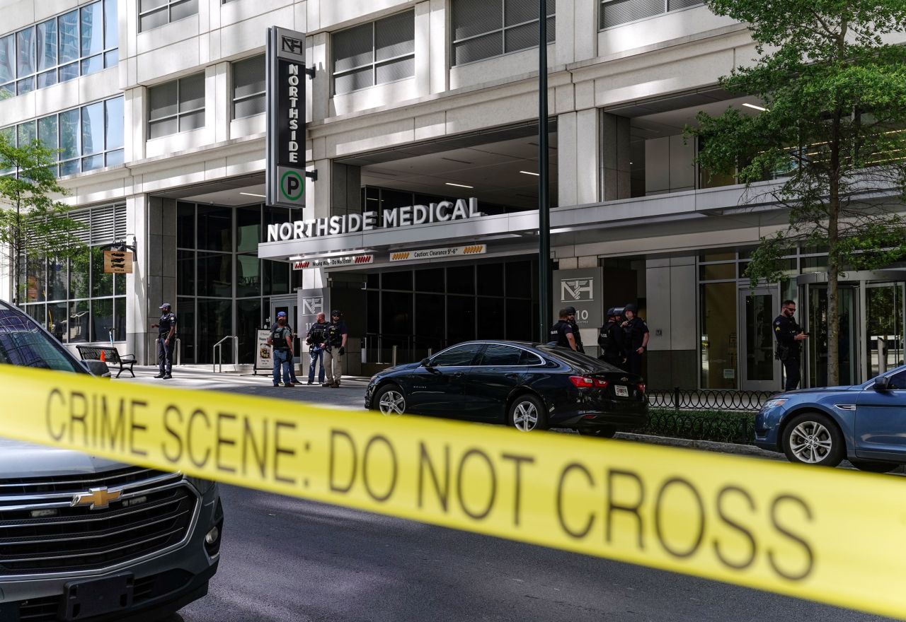 Police officers work the scene of a shooting at Northside Medical Midtown in Atlanta on Wednesday. 